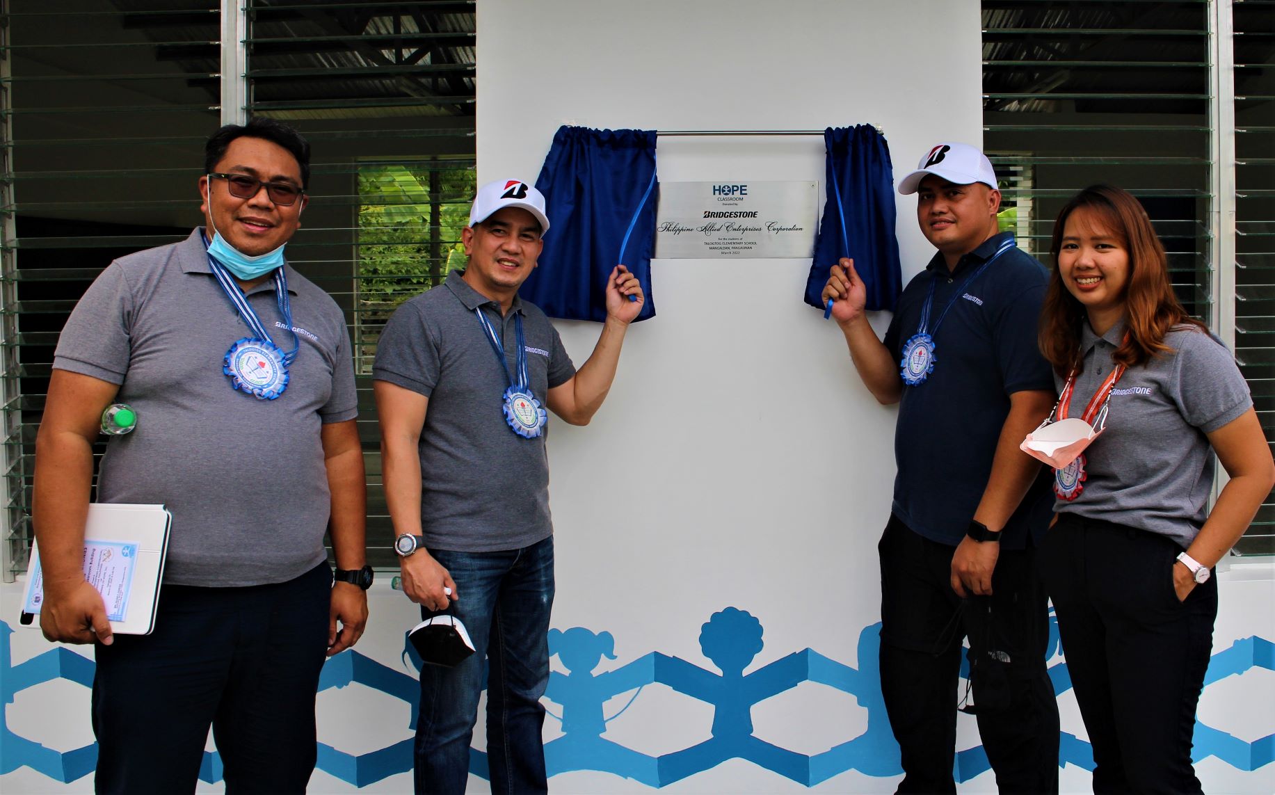 … while Bridgestone associates Jason Peralta, Raymond Villaraza, William Doños and Glaiza Tabangay unveiled the third marker.