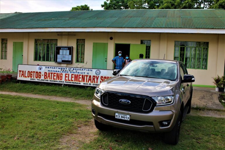To make unloading our donations easier, we backed the Ford Ranger pickup truck near the entrance of the school clinic and library.